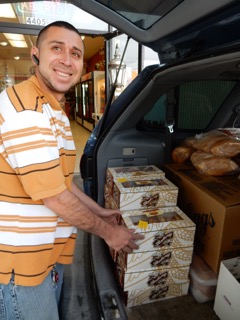 Delivery man Jose Eric Flores loads the van.