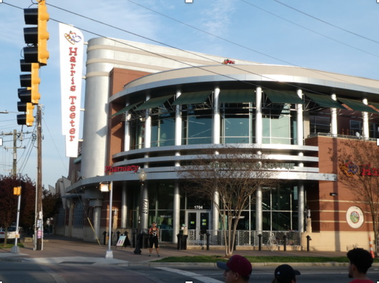 W.T. Harris (a major Charlotte boulevard is named after him) opened his first little grocery store at 1504 Central Avenue in 1936 (now Mama’s Caribbean restaurant). In 1951 he built a much bigger store here as his initial “supermarket.” In 1960 Harris merged with a competitor to form Harris-Teeter, which became a major food force across the southeastern US. In 2013 Harris-Teeter tore down the 1951 building and erected what you see today. Check out the Starbucks coffeeshop and also the roof-garden seating area upstairs.