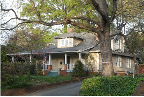 Before The Plaza became "The Plaza" in 1912, it was a dirt farm road through strawberry fields. Perhaps this was the farmhouse. It certainly looks the part – sited on a hilltop, spacious under its late-Victorian gables. The earliest known resident was W.H. Hall, who listed his occupation as "farmer."