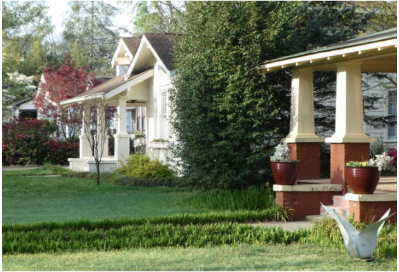 Compare Victoria with the Bungalows across the street. Where Victorian houses reached for the clouds, Bungalows hugged the ground. Observe the sweeping roofs with eaves supported by brackets, the rustic wood-shingle siding, the solid looking porch columns that are broad at the base. How many other Bungalows can you count on your walk?