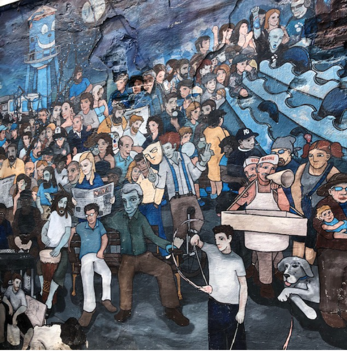 Busy Will Puckett’s Revolutionary War history mural marks the Matheson Street Bridge entrance to NoDa and his animal mural enlivens the Neighborhood Theater. Here he takes NoDa itself as his subject. Can you find the Mecklenburg Mill water tower? How about twins David and Scott Brooks, whose Brooks Sandwich shop at 2710 N. Brevard Street is a favorite stop for chili-onion-slaw hotdogs (our tour ends a couple of blocks from there – just sayin’).