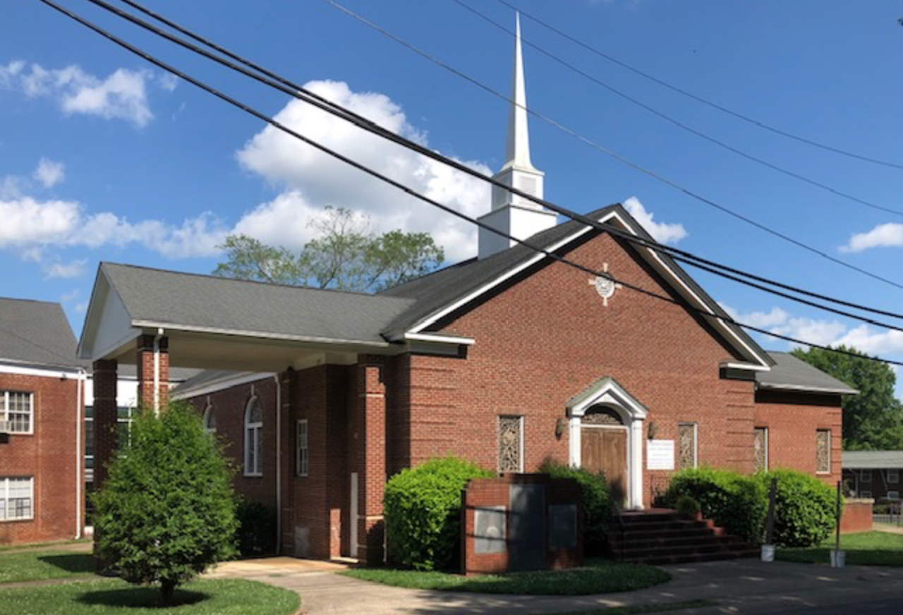 Clinton Chapel was Charlotte’s first AME Zion Congregation, the “mother church” from which all of the city’s many other AME Zion churches sprang. It’s named for Bishop Joseph J. Clinton who sent AMEZ missionaries throughout the South as Union troops won freedom during the Civil War: African Americans “flocked to her standard as it was unfurled by Bishop J.J. Clinton amidst shot and shell, fire and smoke, gleam of sabre and shout of war,” wrote a biographer. Clinton Chapel moved from Charlotte’s center city to this building in 1966 as the Seversville neighborhood was shifting from white to black. Durham Memorial Baptist Church, a white congregation, had originally constructed the sanctuary in 1951.