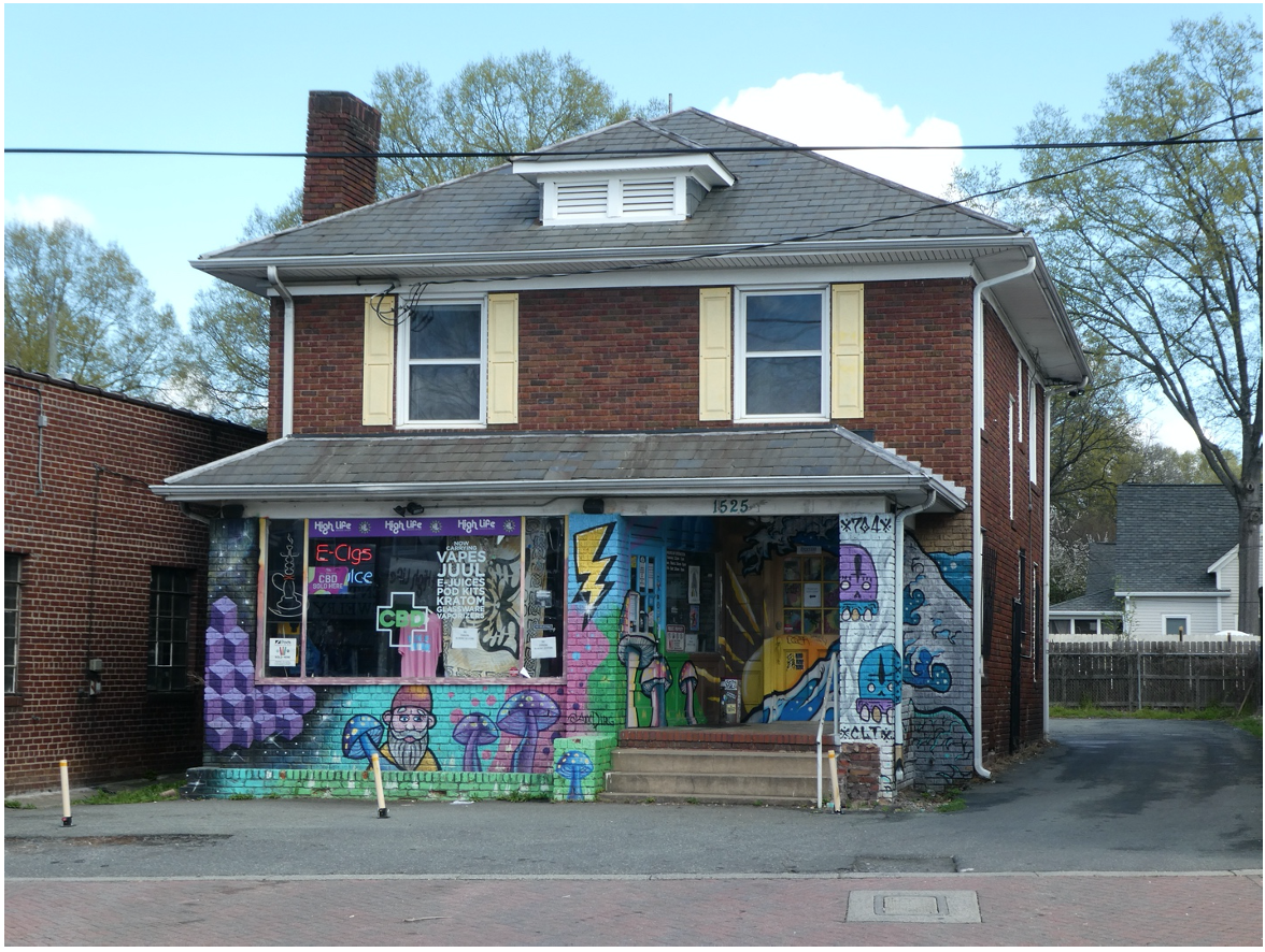 This red brick Four Square style house, tucked back from the street among commercial buildings, is a smoke shop now, but it started life as a parsonage about 1926. Before Holy Trinity Lutheran moved to its present building at 1900 The Plaza, the church occupied the lot where Workman’s Friend now stands and its minister lived here.