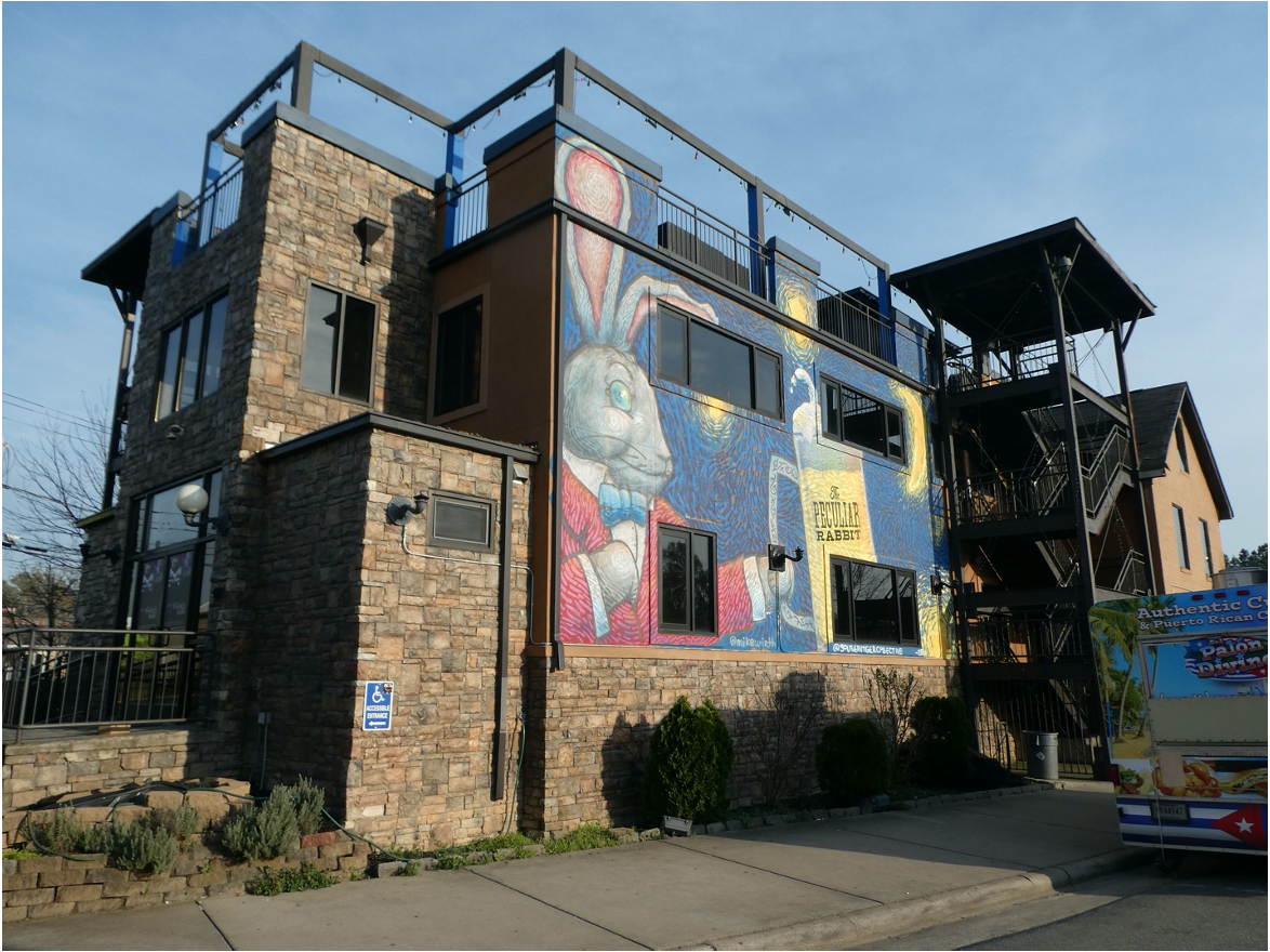 You can’t miss the eye-popping murals by Southern Tiger Collective, co-led by Queens U art prof Mike Wirth. This wacky architectural assemblage began life as Central Wesleyan Methodist Church, opened in 1948 when Pecan Avenue was a gravel road. In the '70s Jim & Tammy Faye Bakker used it as a call center for their PTL TV ministry. It became a nightclub called The Steeple in the 2000s, then was massively re-done and expanded as Peculiar Rabbit. Right now, everyone’s waiting for the next re-incarnation …