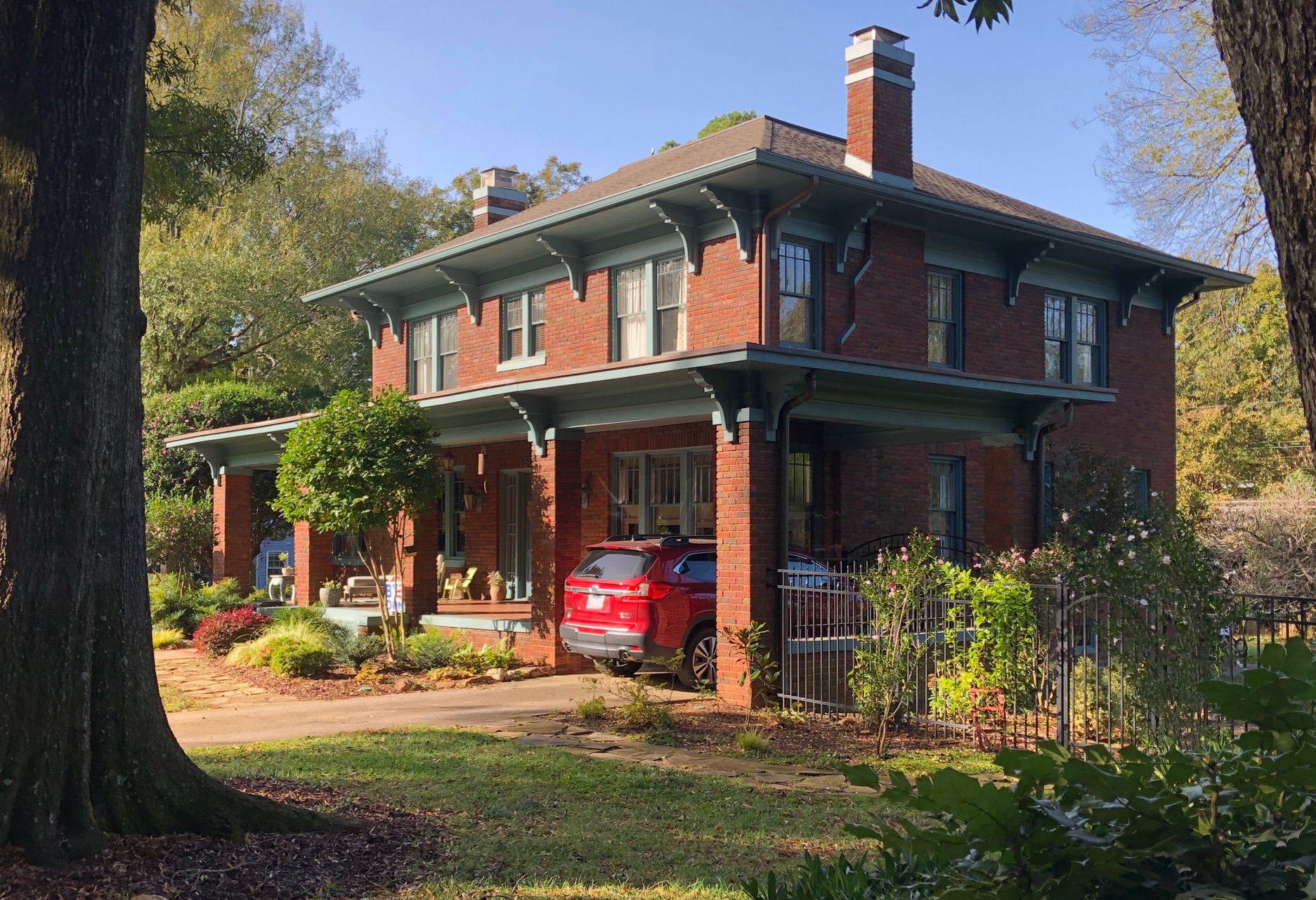 The Plaza might have become Charlotte’s prestige address … but Myers Park won the game. This stately home dates from that early rivalry. Its dark-red brick has Prairie Style touches that recall the ideas of Chicago master architect Frank Lloyd Wright. Note especially the very broad eaves. It was built about 1916 for the proprietor of a downtown feed store.