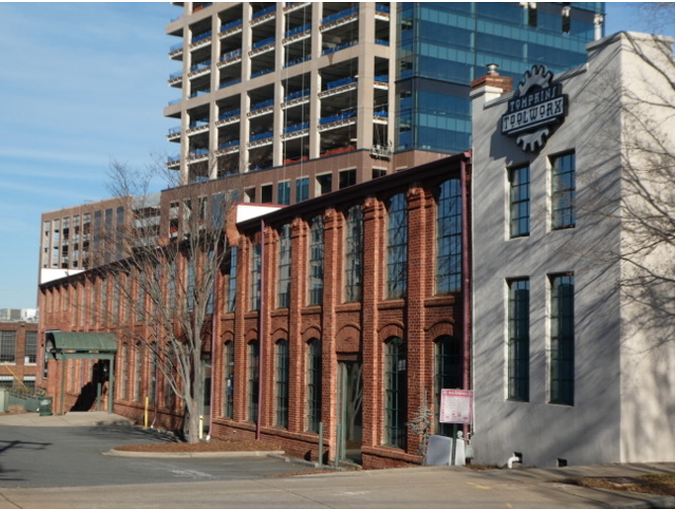 Look across the street to see another D.A. Tompkins building. He had this foundry and machine works built beginning in 1902 to produce and repair specialized machinery for textile mills and cottonseed oil processing plants.