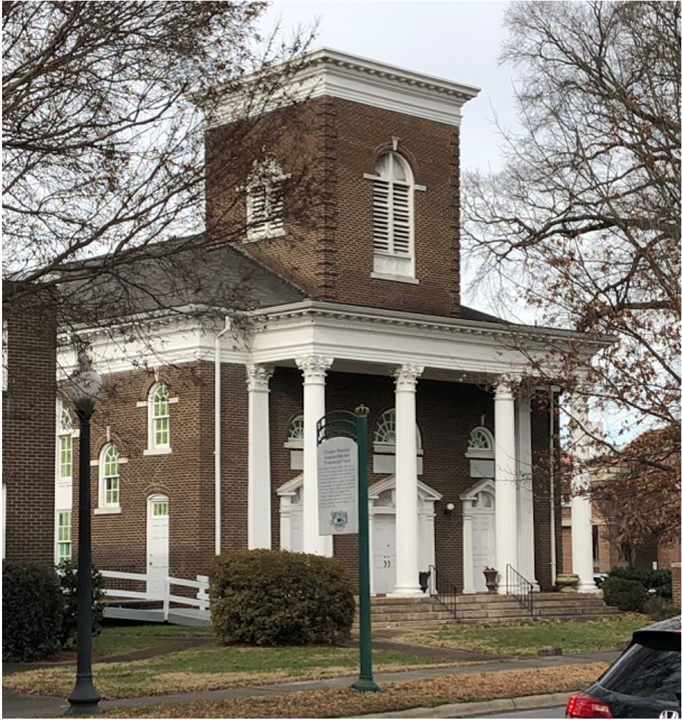 Now Grace Covenant, this building was dedicated in 1910 as Chalmers Memorial, a church in the Associated Reform Presbyterian denomination. Its most famous member was young Billy Graham, whose family farmed near what is now Park Road Shopping Center.