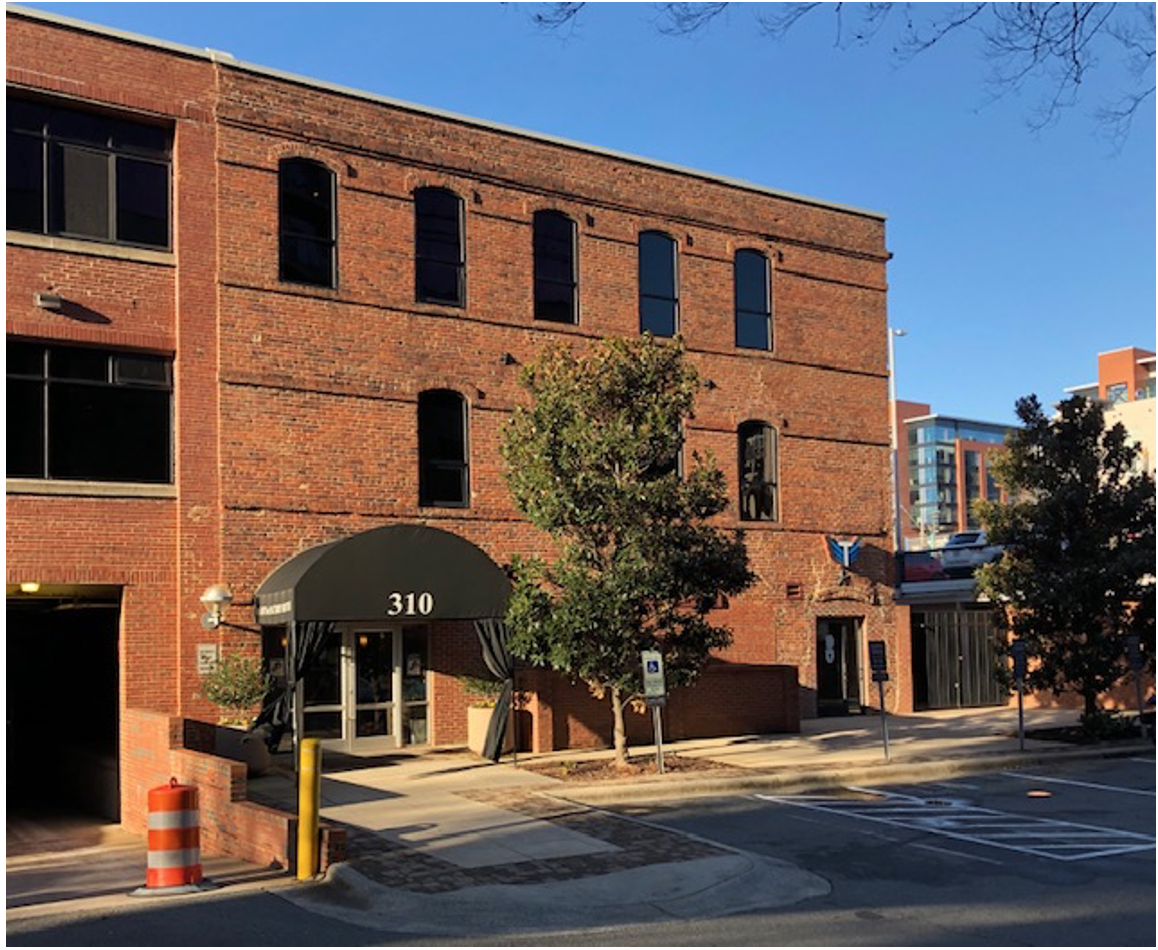 At the back of the Lance complex, see the plain-looking three-story building with brick arched windows? Young Charlotte newcomer Edward Dilworth Latta started out selling men’s clothing, then got into manufacturing. This was his Charlotte Trouser Company factory. He put its profits into streetcar development and real estate – launching the streetcar suburb of Dilworth in 1891.